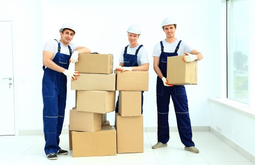 Furniture removal team planning a move in Highbury with careful handling of large household items