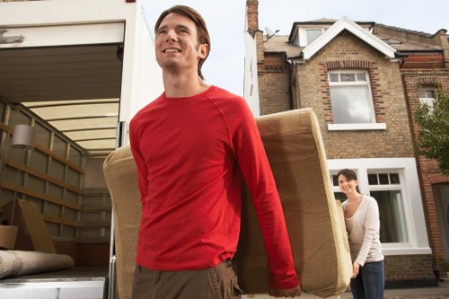 Local man and van loading furniture in Highbury street