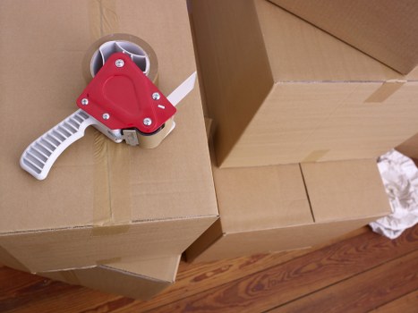 Careful packing and wrapping for a home move in Highbury