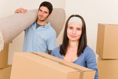 Professional movers loading sofas and tables for furniture removals in Highbury flats and homes