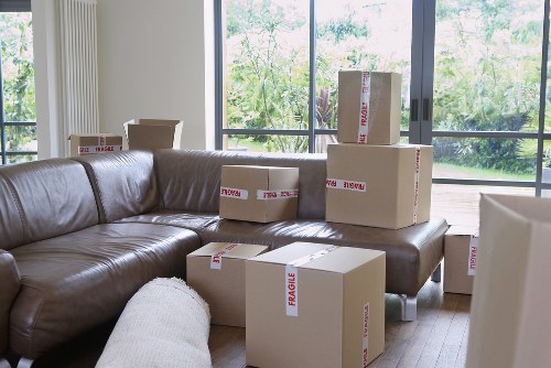 Local removalists handling furniture in a suburban Highbury home