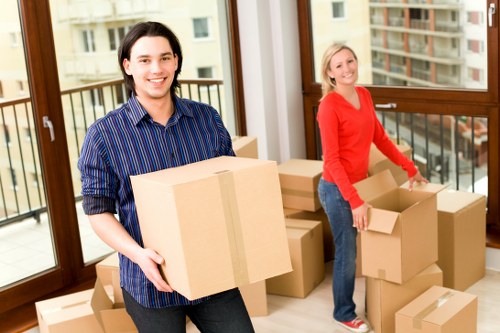 Local removals van loading items near Highbury properties